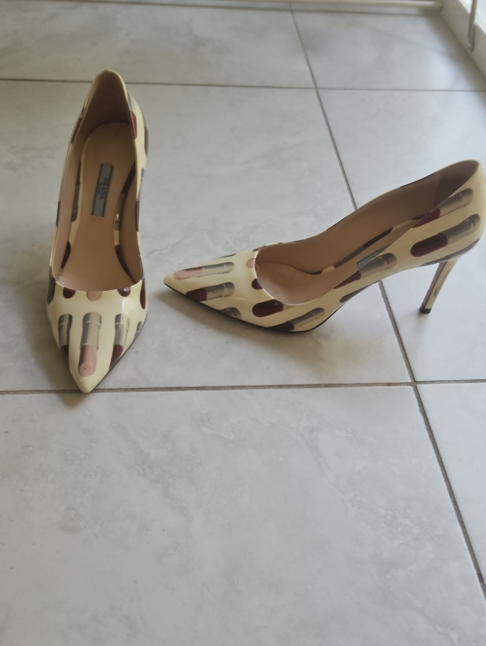 Prada Pointed Toe High Heel Pumps in Cream with Lipstick Print